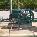 An "intermittent cycle" deisel engine.  It fires when the speed falls below a certain RPM and then shuts off (mechanically) when the speed is up.  I've seen models running off compressed air, but never one "in the flesh".