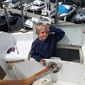 As part of the backstay chainplate refit, I need to remove the oak trim at the back of the boat.  It's bolted through, so I have to get to the nuts on the bottom.  There's NO WAY for an adult to get in their now, so I had to recruit a helper.