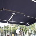 It's a standard three hoop design, slit to fit around the backstay.