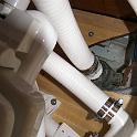 Here's a close up the hose leaving the toilet pump and the hose out of the through-hull.  It's very tight.