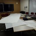 My success with Hank's main started to get me feeling pretty good my sewing ability, so I decided to step it up, and ordered a "kit" from Sailrite for a 110% genoa.  The Sailrite videos sure made it seem like this was something I could accomplish.  I brought the kit into work and set up shop in our largest meeting room.  I quickly realized that as big as the room was, it was still going to be WAY TOO SMALL.  All I could do was to set up as diagonally as possible.