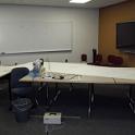 Even diagonal, the room was not nearly big enough, but I made the best of it.  It was LOT of work, WAY more than I ever expected!  I took me about 16 hours to sew "the white", which was about four times as long as I expected, and still only half the job.  (The sacrificial Sunbrella took equally long, and even the leather patches took a few hours.)   I did not realize how stiff a new sail could be when rolled up, and how slippery it was when it wasn't.  I spent fully half the day either moving the sewing machine around or picking the sail up off the floor!   But the Sailrite instructional videos made is seem so easy!   A few weeks after it was together I went back and reviewed the videos.  99% of it was a close up on a person's hands as they sewed.  But just once, just for a few seconds, the camera panned back, to show a sewing table about the size of an ice rink!