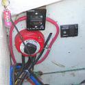 Sadly, this is the only "before" picture, perhaps just as well.  The surveyor noted an electrical problem to be attended to, namely, that the batteries were just sitting in the bilge, held in place by the cables and their own weight; attrocious.  This prompted a closer examination of the wiring and what I found ranged from terrible to just plain dangerous.  Wires were dangling loose, speaker wire was used extensively for power cables (including the bilge pump!), the wrong size wire was used and so on.  There was actually a pair of speaker wires with bared ends connected directly to the battery!  No switch, no fuse, nothing.  A major rework was in order.