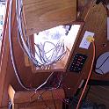 This goofy box used to house the radar unit, with a plexiglass cover allowing it to be seen from the cockpit.  Now, radar visible from the cockpit is a very good idea, but the implementation left something to be desired.  The radar will instead be surface mounted on a big slab of teak, still visible from the cockpit, along with the chartplotter and autohelm control.  In back will be the "navigation electronics" centre, as there is going to be a whole whack of electronics going in.  (I just can't resist)  You can see white tape at the end of the wires.  I was religious about properly labelling both ends of EVERY cable I put in with the right 3M numbering product, and then went a step further by protecting the numbers with a length of clear heat-shrink tubing.