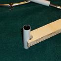 Mind you, getting that piece of PEX into position 6 feet down the inside of the boom was going to be a problem.  Here's the fix, a holder made of plywood.  It held the pex securely enough to not slip off but would let go with a solid tug.