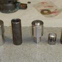 Here's some tools made up on my lathe.  Left to right, we have a bearing insert tool to press against the outer race, another to press against the inner race, a seal insert tool and two "gauges".    With the pump still assembled, I made these gauges to show me precisely where the bearings sat in relation to the end of the shaft.  You'll see this a couple of pictures from now.