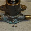 Next step was to install the "cam"; the brass bit that actually does the work of pumping.  The cam is held in place with a brass screw, that broke with just the gentlest of pressure.  I elected to use a stainless steel replacement, taking care to use suitable goop to pretect the dissimilar metals.  I also noted upon disassembly that there was a THIN film of what looked like silicon seal between the cam and the pump body.  I added some as well, the key being THIN.  Note quite sure of why this was there .. perhaps as a seal, perhaps to hold the cam in place if the screw is ever removed to drain.