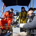 Takes teamwork to fly this sail.